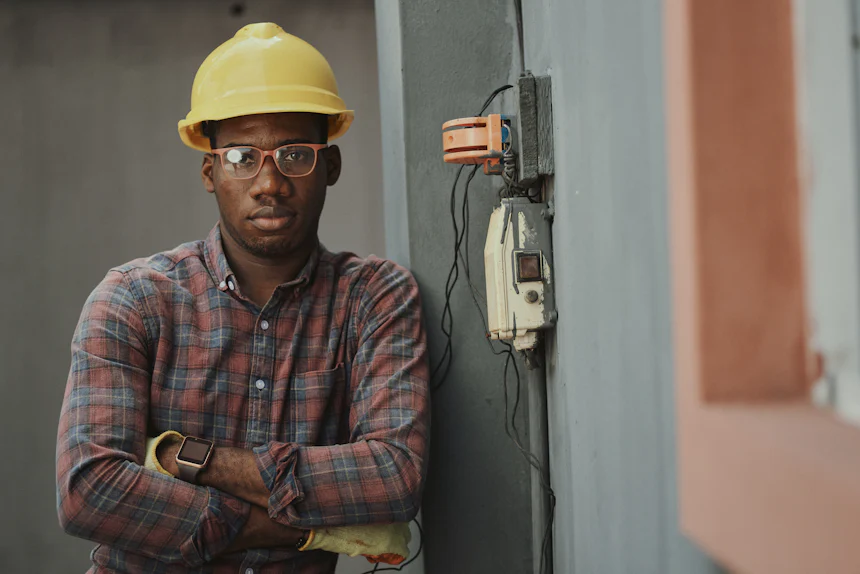 Engineer in a yellow hard hat on a technical site